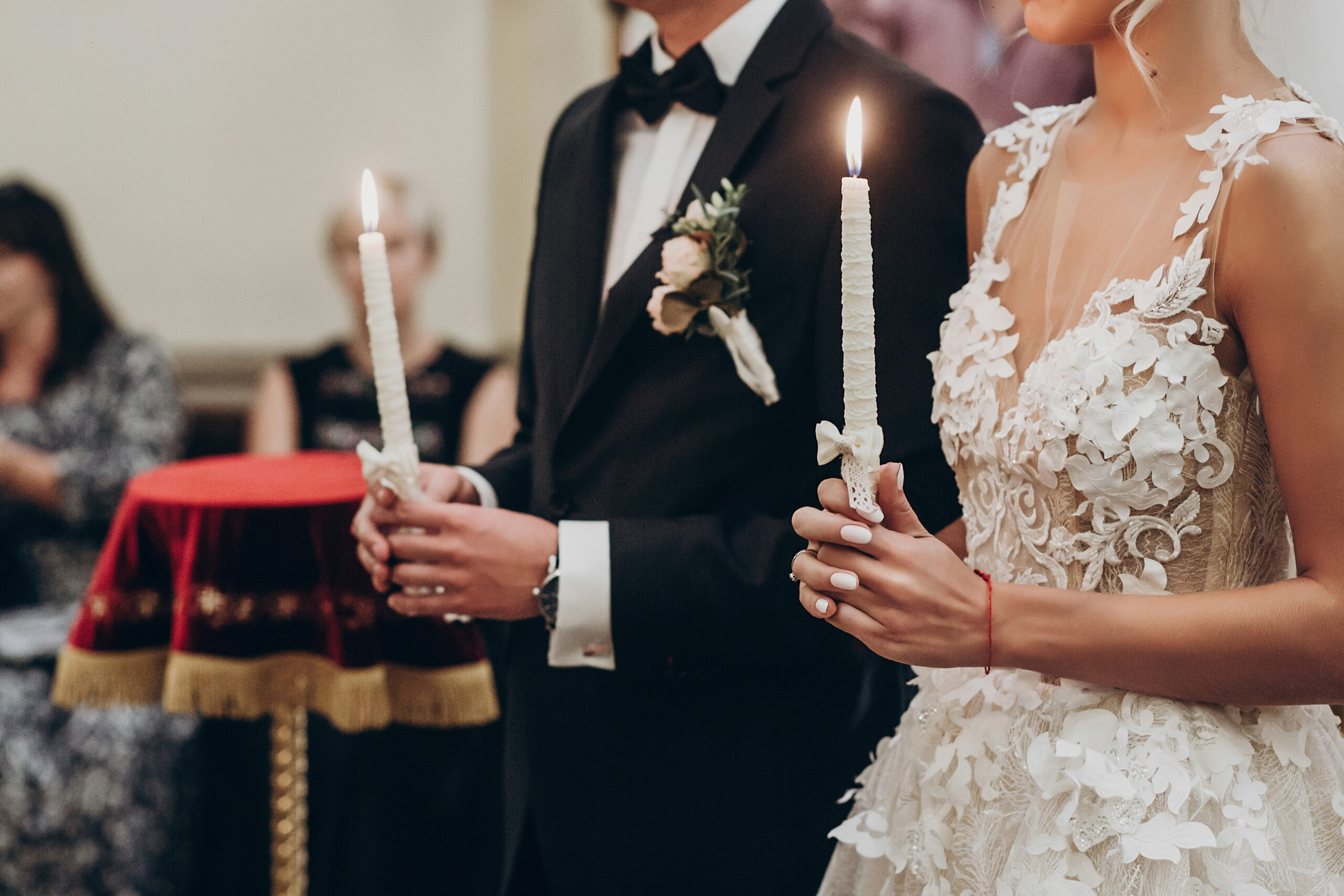 luxury wedding couple holding candles with light during traditi